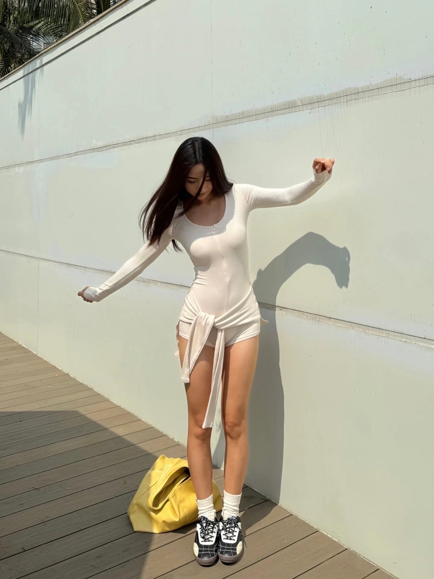a- White two piece long sleeved bodysuit